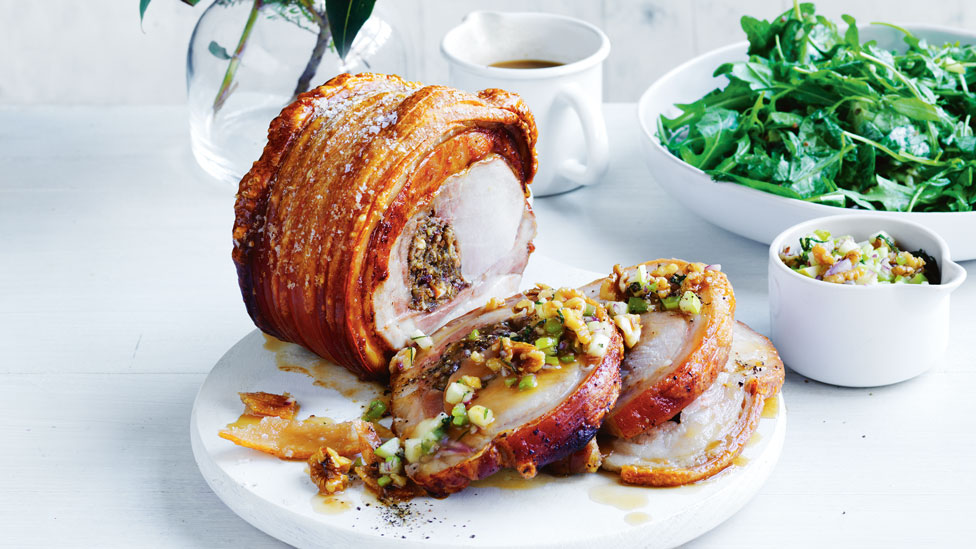 Thickly sliced roast pork with apple and walnut salsa