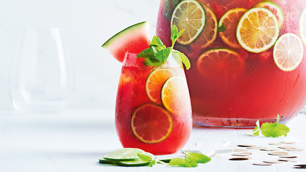 Watermelon and lime caprioska punch with mint and watermelon wedges