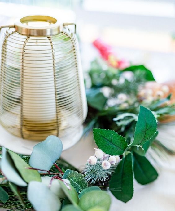 A christmas lamp with mixed holly and mistletoe