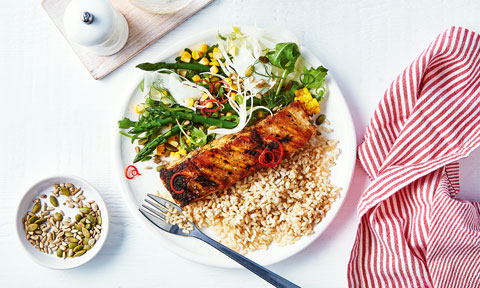One serve of chargrilled barramundi with fennel and asparagus salad, and mixed seeds on the side.