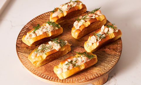 6 slices of brioche bread topped with a creamy prawn mix