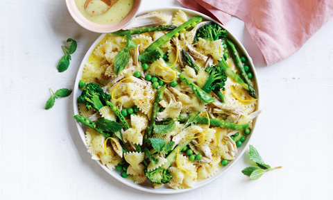 A bowl of bbq chicken pasta salad with peri peri marinande