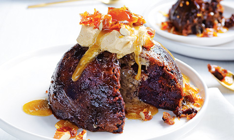Christmas pudding topped with almond praline butter mixture