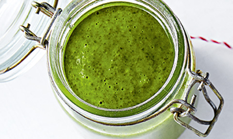 Vibrant green jalapeño chimichurri in a glass jar.