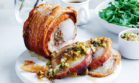 Thickly sliced roast pork with apple and walnut salsa