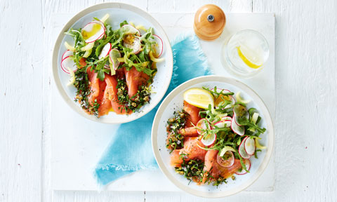 Two bowls of smoked salmon carpaccio with oil
