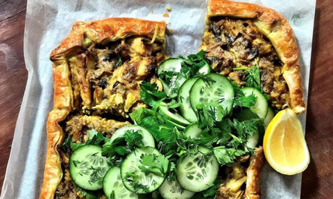 A freeform turkey pie with cucumber and lemon