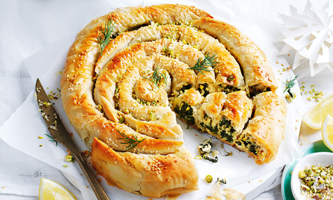Vegan spinach filo scroll in wedges with chopped pistachio