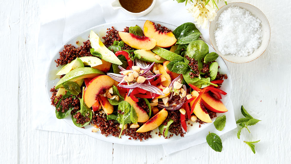 Peach and quinoa salad with dressing.