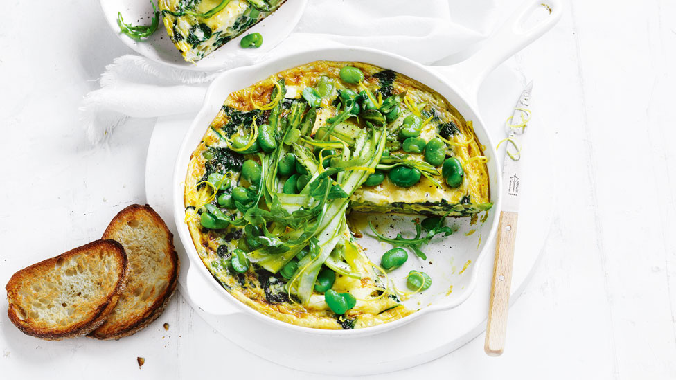 A broad bean and spinach frittata topped with alfalfa