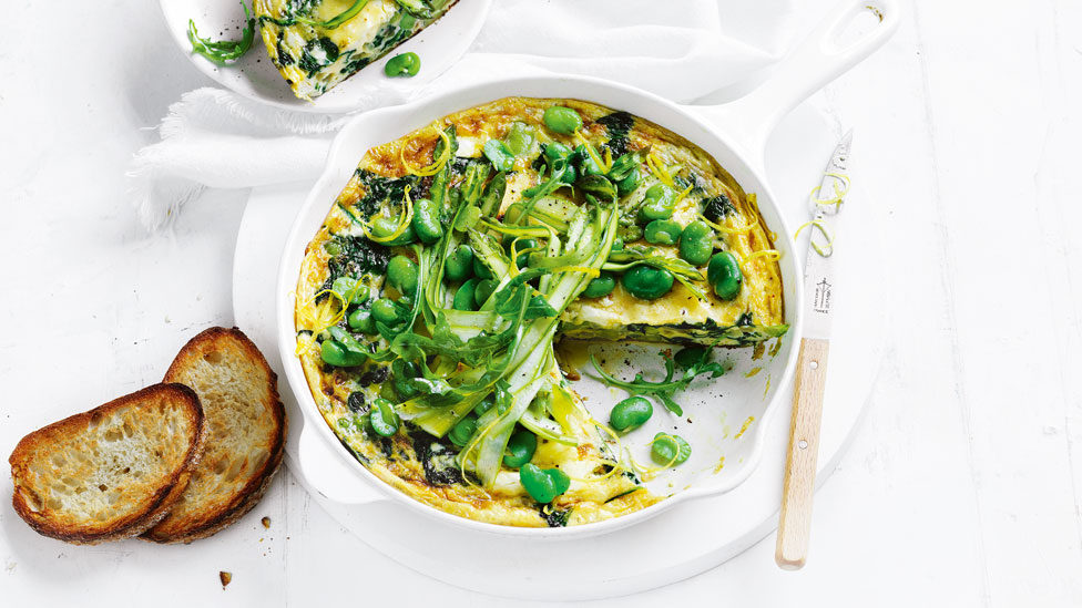 A broad bean and spinach frittata topped with alfalfa
