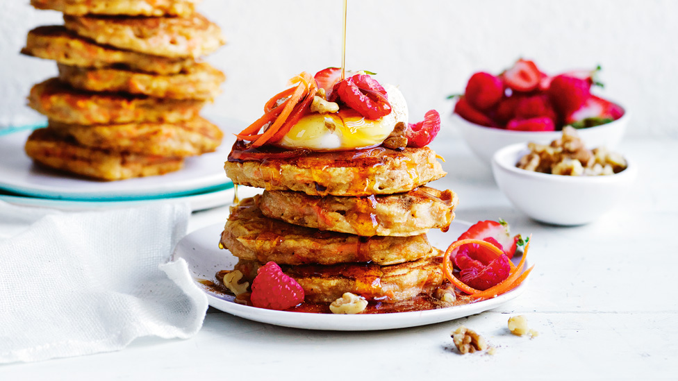 Stacks of carrot cake pancakes with berries