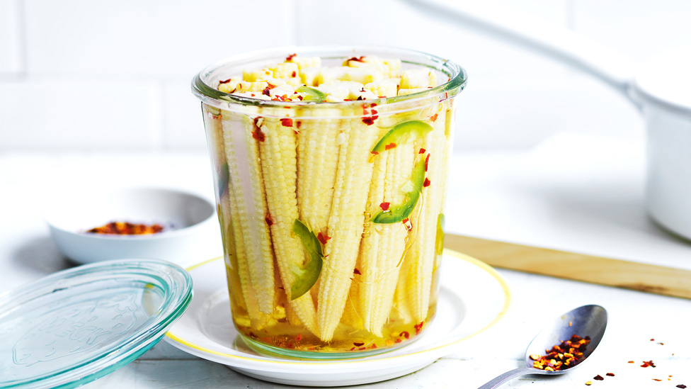 A cup of chilli pickled baby corn