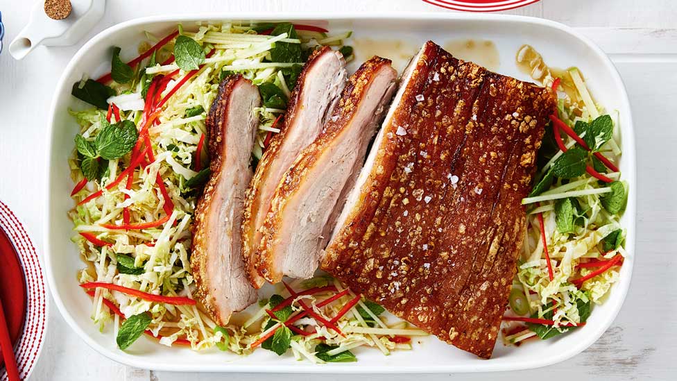 Thickly sliced Chinese five spice roast pork belly with wombok mixture