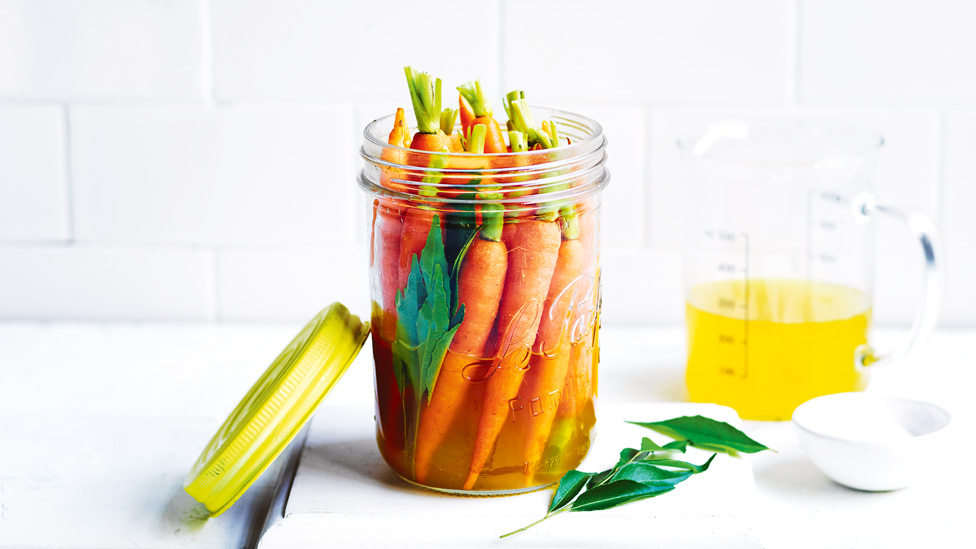 Curry spiced baby carrots in a jar