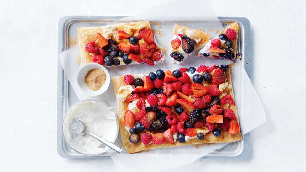 Ricotta tart topped with mixed berry and cinnamon