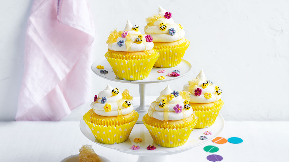 5 beehive cupcakes on a high tea stand