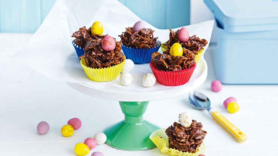 Six cornflake chocolate nests with Easter eggs