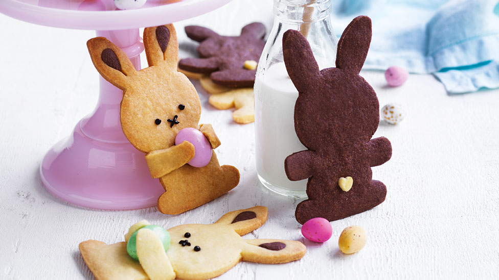 Three Easter bunny biscuits with Easter eggs