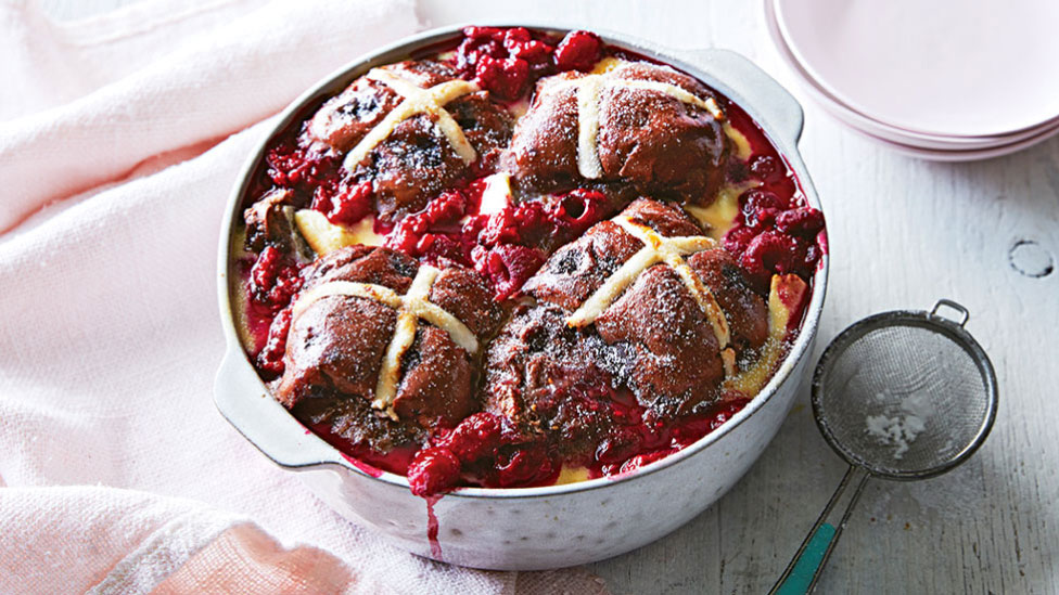 Raspberry and chocolate hot cross bun pudding in a large roasting pan