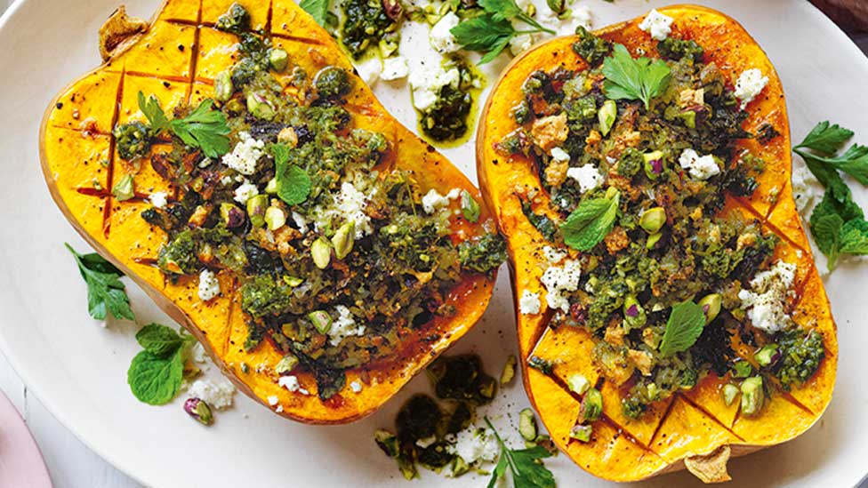 Rice-stuffed butternut pumpkin cut in half