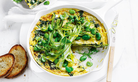 A broad bean and spinach frittata topped with alfalfa