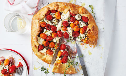 A free form pastry tart with tomato and cheese