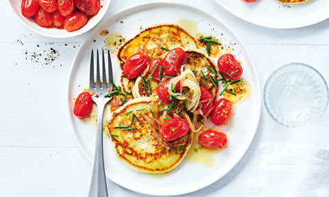 Herbed buttermilk pancakes topped with burst tomatoes 