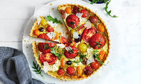 Wholemeal mixed tomato quiche cut into wedges