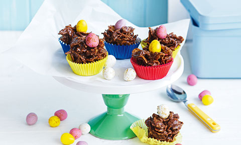Six cornflake chocolate nests with Easter eggs
