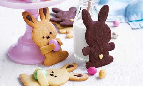 Three Easter bunny biscuits with Easter eggs