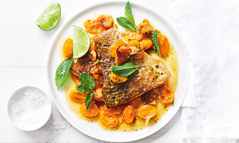 Portions of crispy-skin barramundi with golden tomato, lime and ginger sauce
