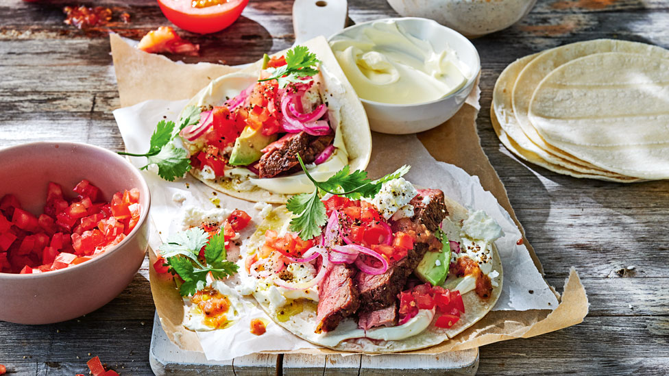 Steak tacos with fetta and salsa roja