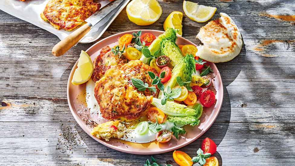 Tomato fritters with yoghurt and salad