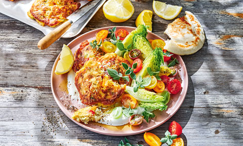 Tomato fritters with yoghurt and salad