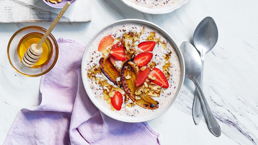 Banana bread overnight oats with strawberries and honey