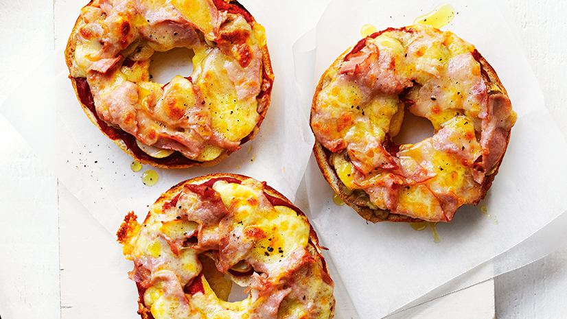 Three bagel pizzas with cheese and ham