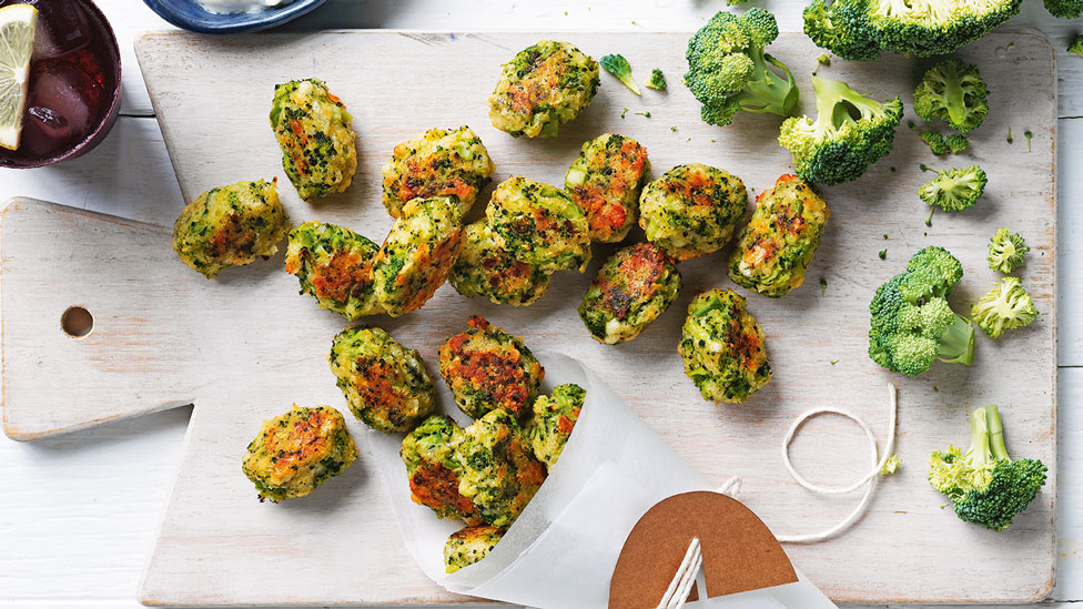 Broc tots served on a chopping board with fresh broccoli on the side