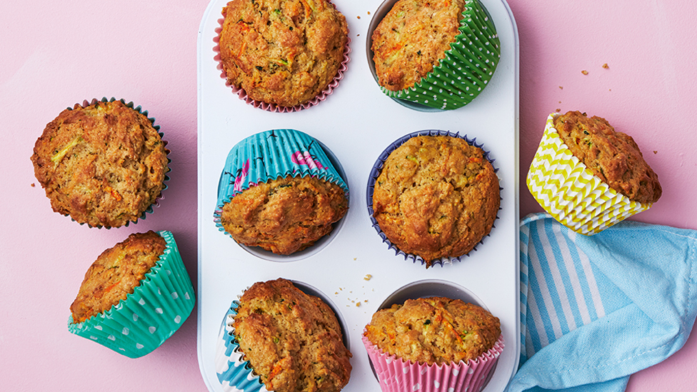 Muffins in cases served in a muffin baking tray