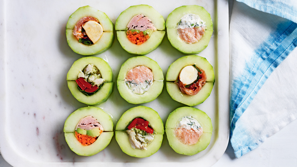 Cucumber sandwich bites served on a serving plate