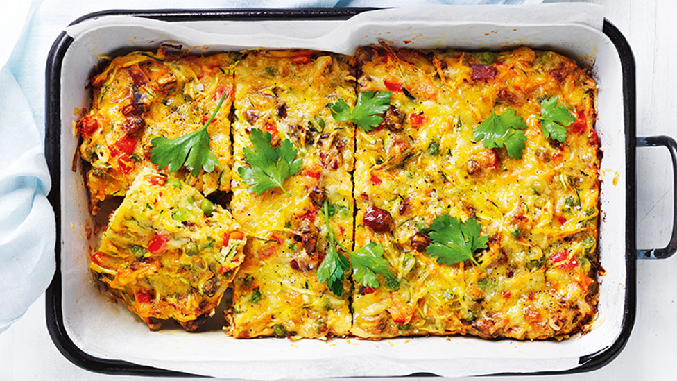 Chorizo and zucchini slice served a baking dish with coriander on top