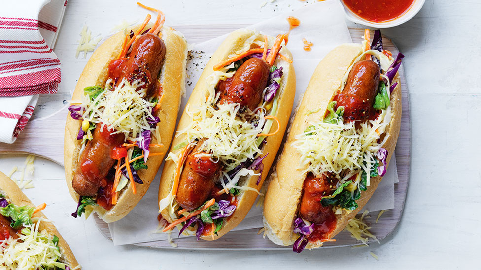 3 mexican-style hotdogs with grated cheese on top