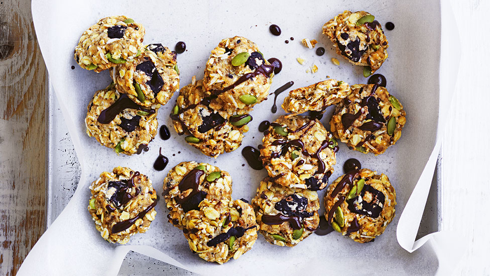 Oat choc cookies served in a baking dish with chocolate drizzle over the top