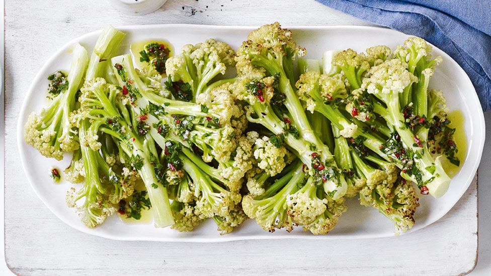 Caulini served on a plate with chimichurri on top