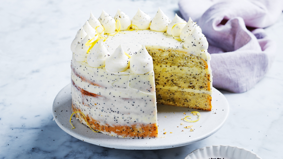 Whole lemon and poppy seed cake with a slice cut out