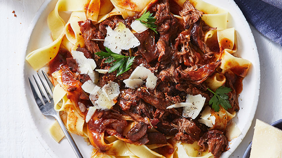 Lamb shank served on pappardelle with shaved parmesan and flat leaf parsley