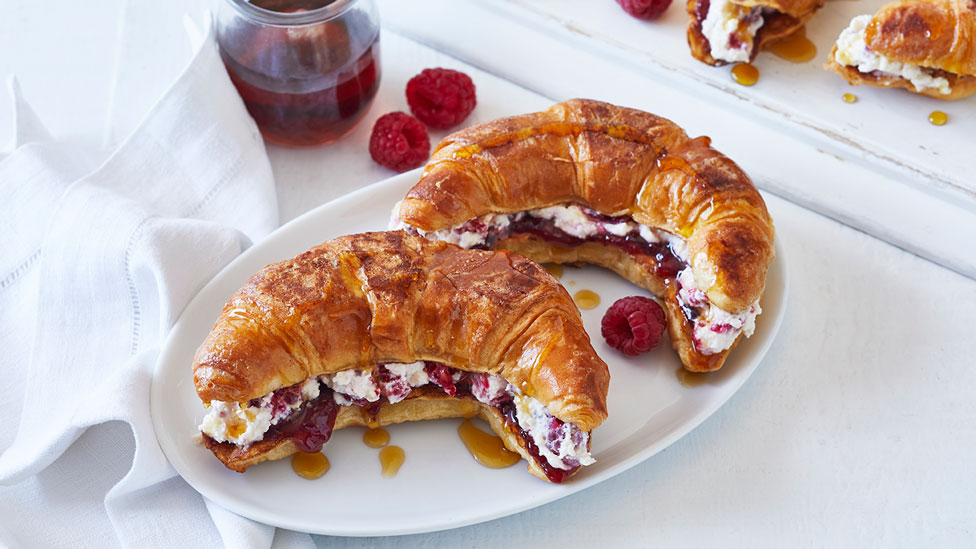 Two Ricotta Raspberry Croissant French Toast on White Plate