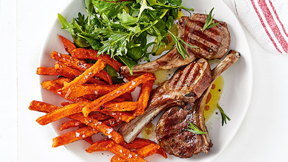 Lamb cutlets served with roasted sweet potato chips and salad