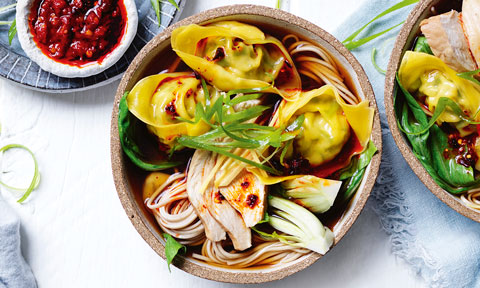 Chinese-style Long and Short Soup served in wooden bowls, a side of chilli in oil. Garnished with spring onion.