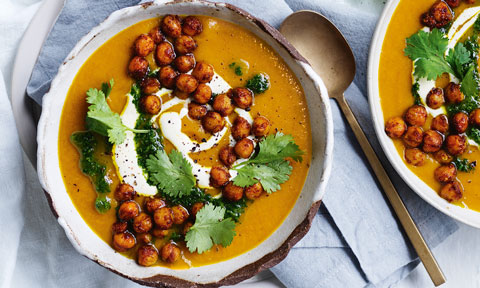 Creamy Spiced Pumpkin Soup with Red Lentils served with yoghurt, chickpeas and parsley. 